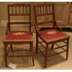 Set of four walnut Victorian side chairs with needlepoint seats.