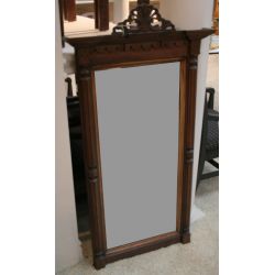 Continental style mahogany and gilt mirror with carved detailing. ca. 1900